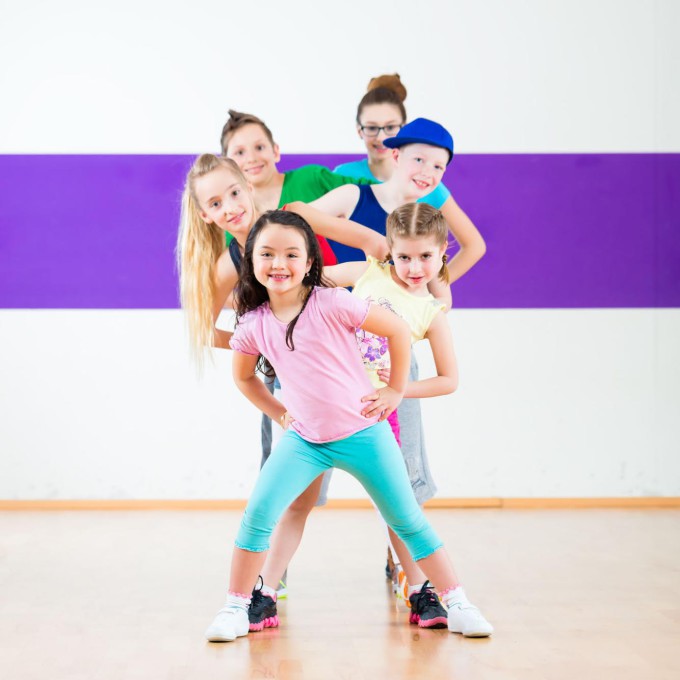 33782981 - children in zumba class dancing modern group choreography
